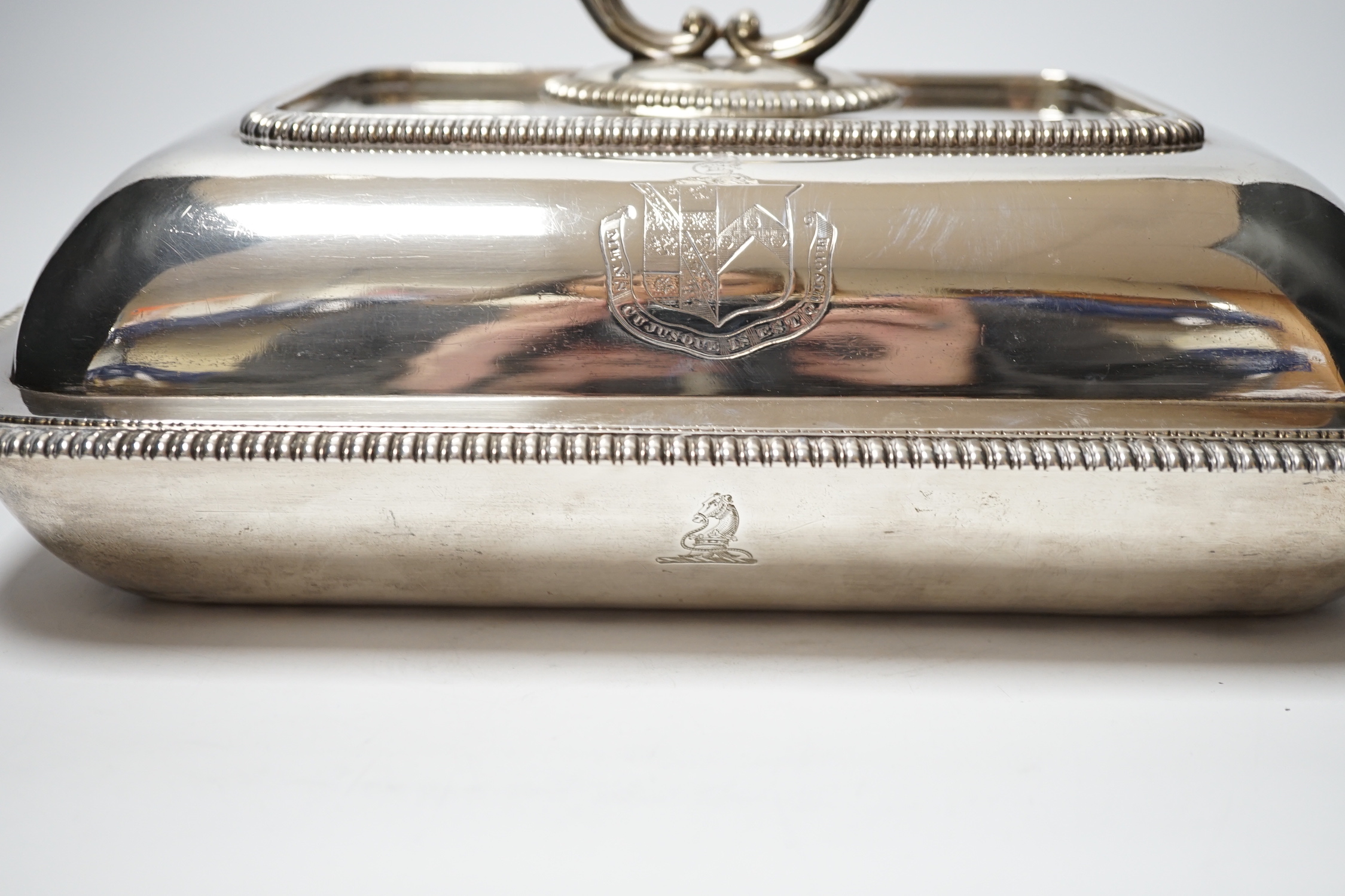 A matched silver entree dish and cover, base Foskett & Stewart, London, 1809, 31.2cm, cover makers mark rubbed, London, 1806, 64.4oz, with a silver plated handle